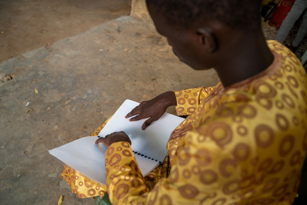 Ndiambe reading braille