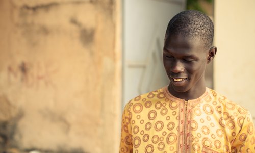 Picture of Ndiambe in a yellow shirt