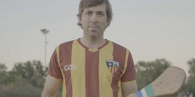 Man holding a hurley