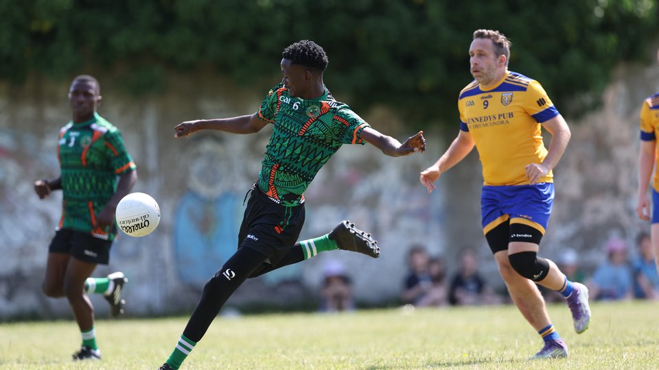 GAA player kicking the ball