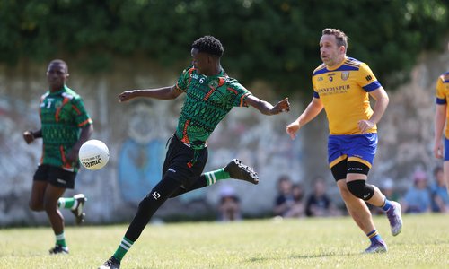 GAA player kicking the ball