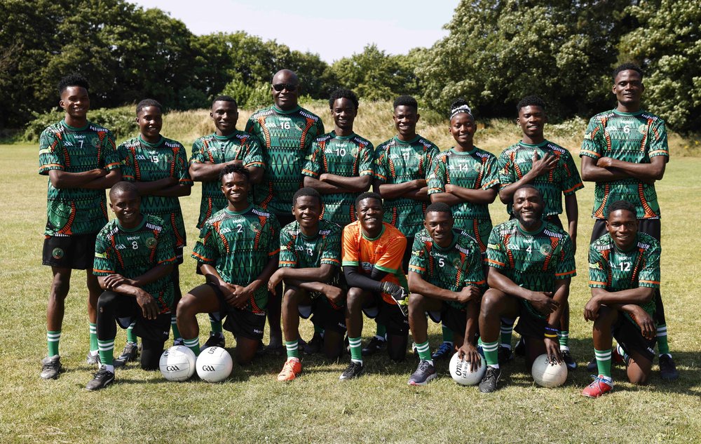 group of football players with gaelic football in bright green and orange jerseys