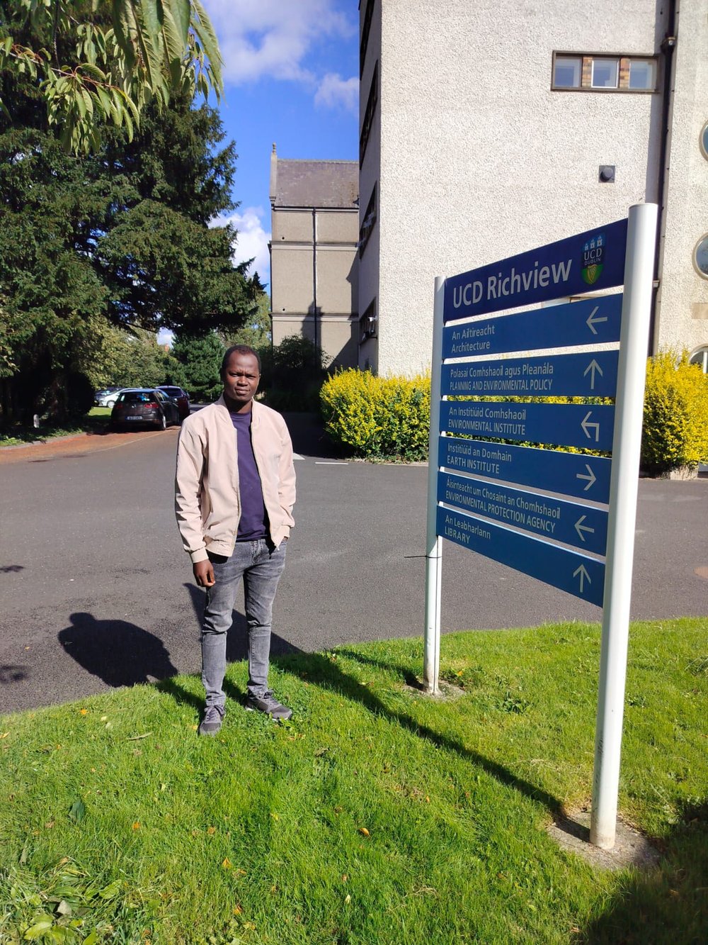 Samuel standing beside a road