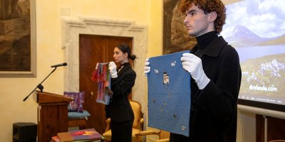 Students holding tweed projects