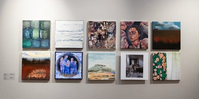 ten artworks inspired by Bloodroot poetry collection on a white wall
