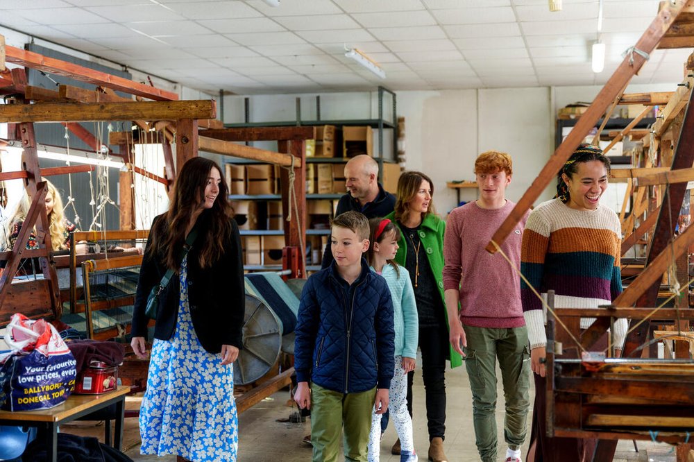 Family walking around a weaving mill in Donegal