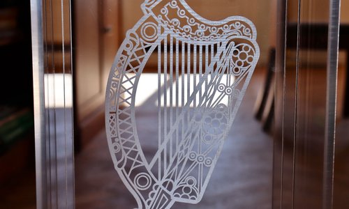 harp etching on a glass door