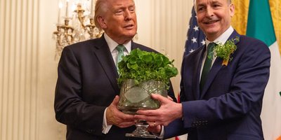 President Trump and Taoiseach Micheál Martin hold crystal bowl of shamrock.