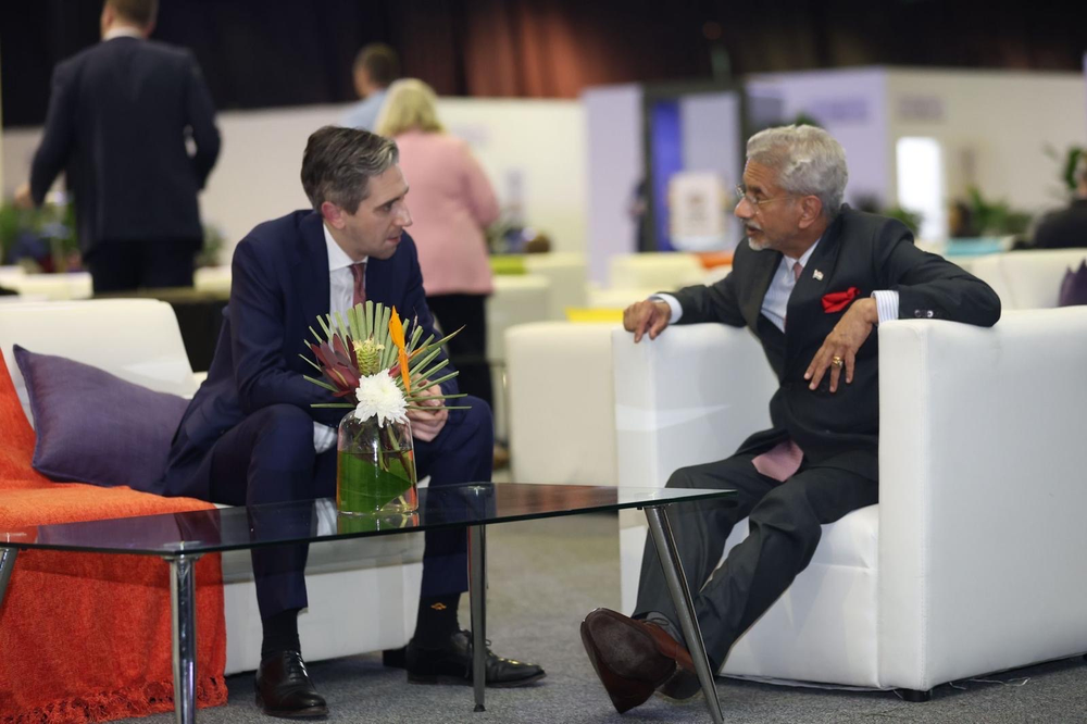 Tánaiste Simon Harris seated with Dr. S. Jaishankar, External Affairs Minister of India at G20 in South Africa