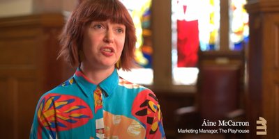 Still of Áine McCarron, the marketing manager of The PlayHouse mid-interview