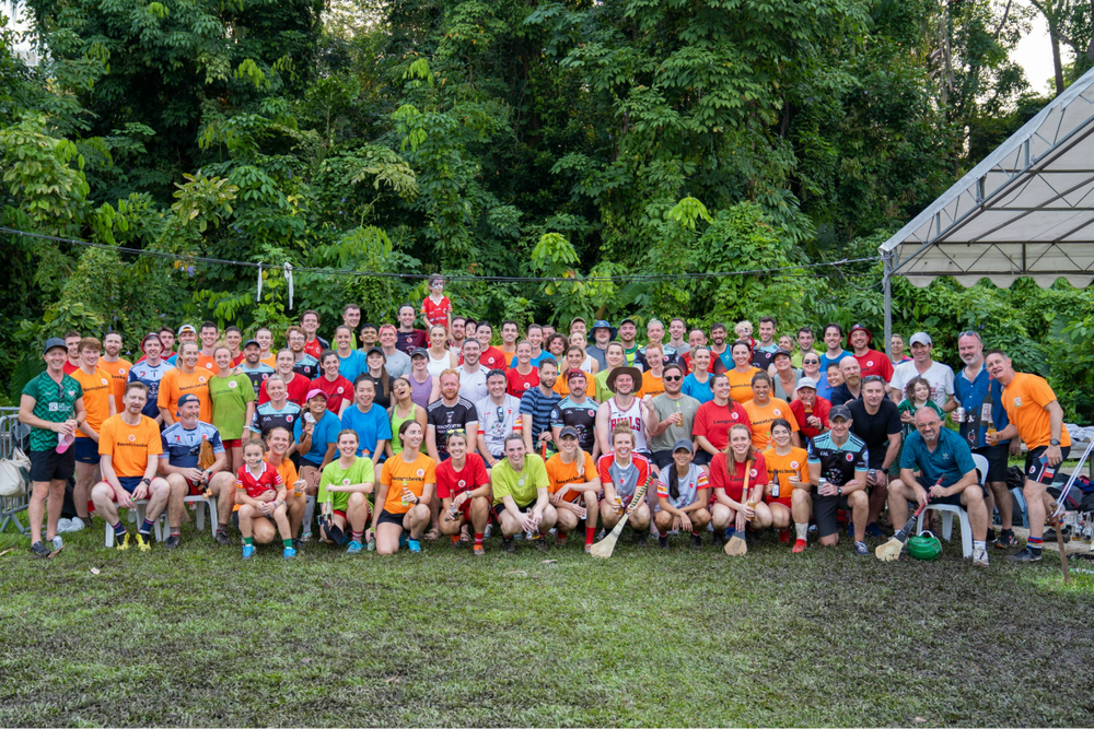 Team photo wearing a variety of colourful bibs