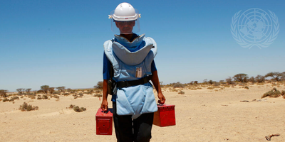 Picture of a man looking for landmines