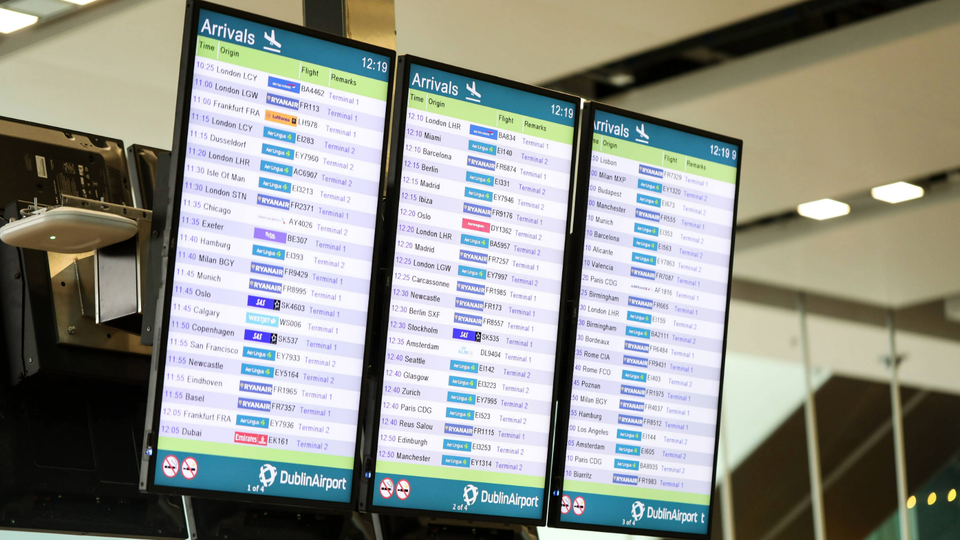 Three departure screens at Dublin Airport