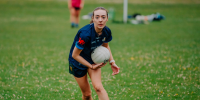 Woman playing Gaelic football