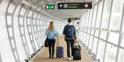 Couple walking at Dublin Airport