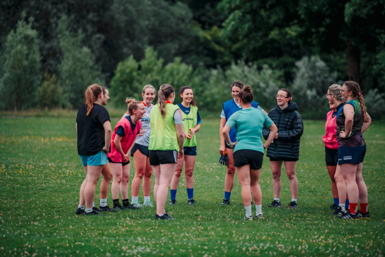 Colmcilles Ladies' football team in a huddle