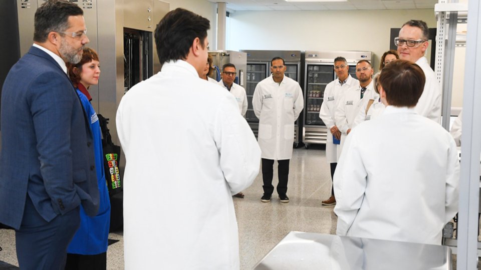 A group of people in lab coats
