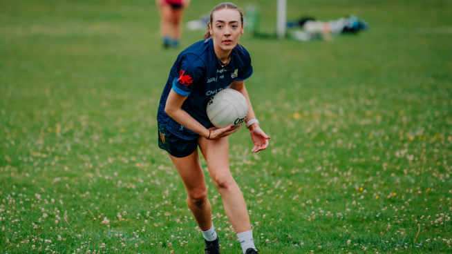 Woman playing Gaelic football