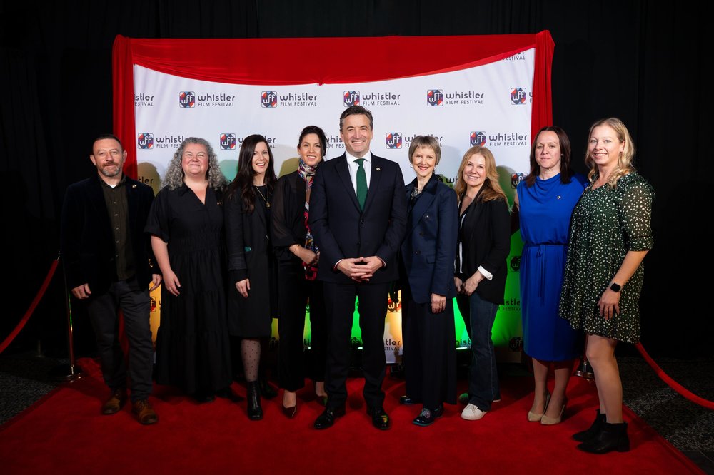 Officials posing for team photo on the red carpet