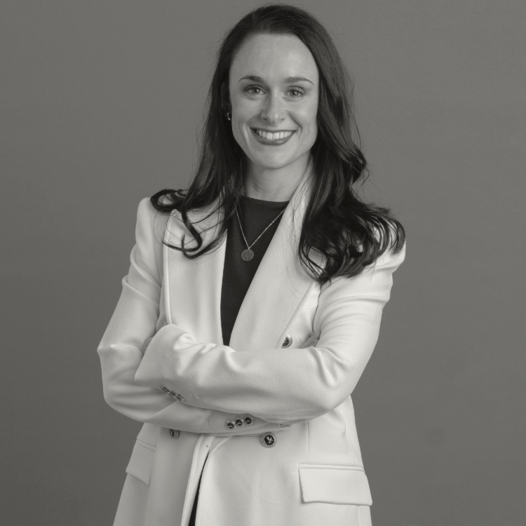 Woman standing with her arms crossed, smiling