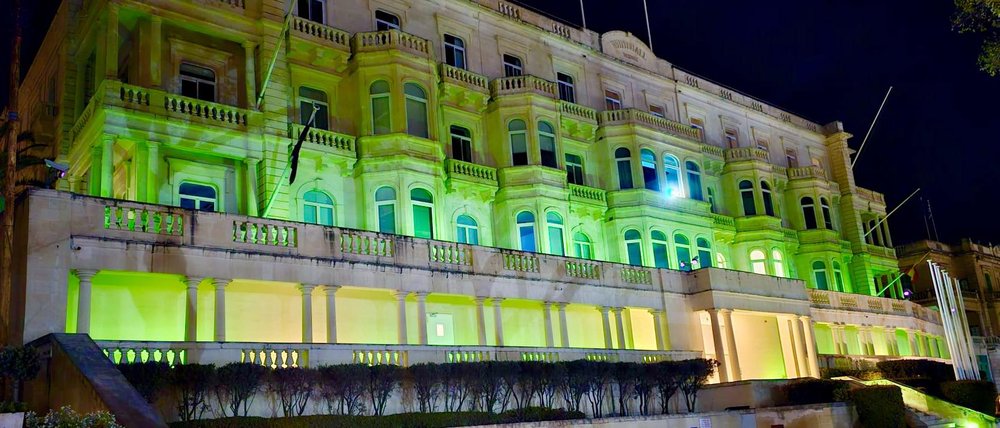 Whitehall Mansions lit up in green