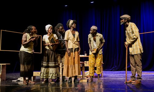 Actors in Brian Friel's Translations on stage in Senegal