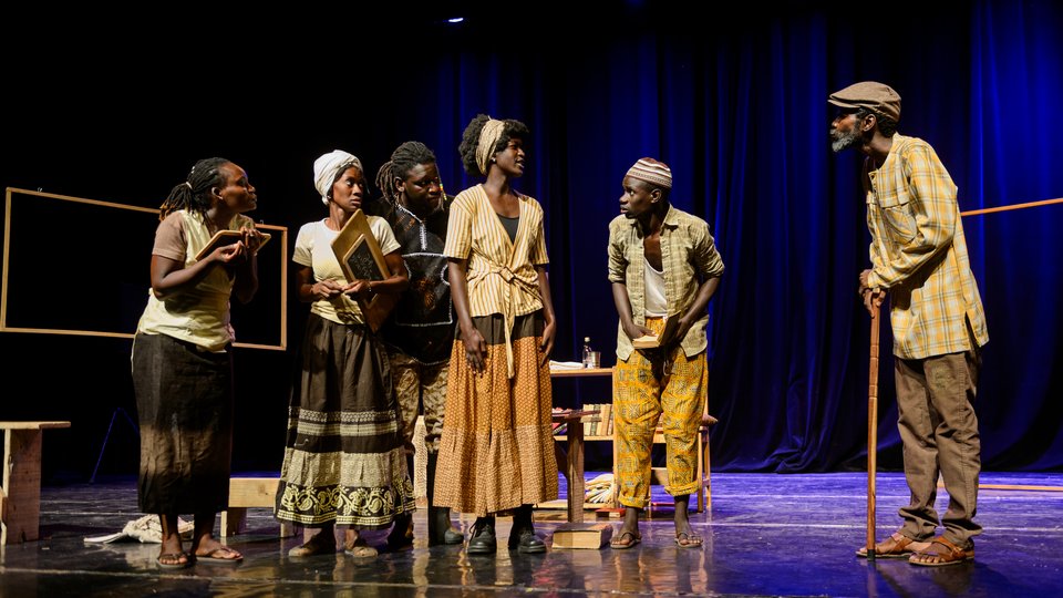 Performers on stage in 'Translations'