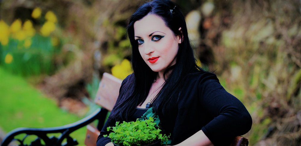 woman sitting on a bench looking at camera