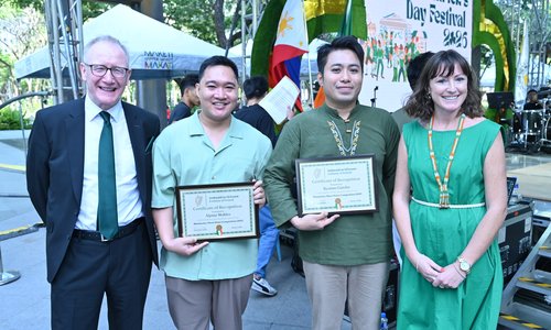 Two people being presented with an award