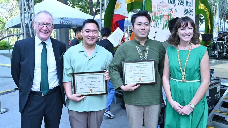 Two people being presented with an award