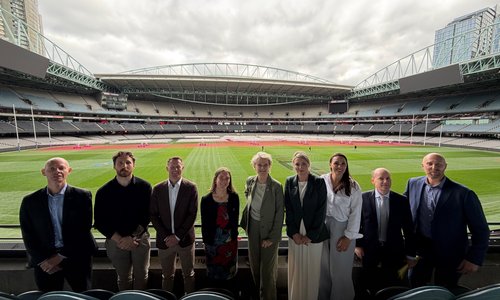 Group of people smiling together in Croke Park.