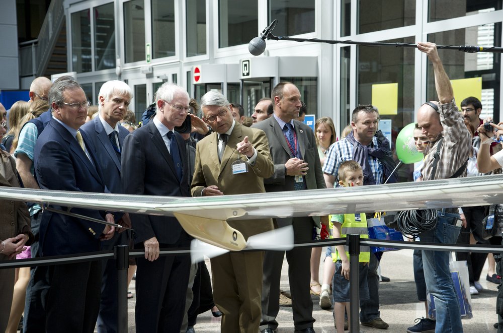 Man cutting a ribbon