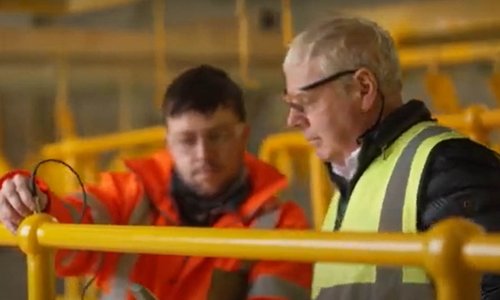 two men in high vis jackets