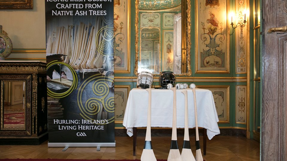 Hurls, hurling helmets and sliotars displayed at a hurling exhibition.