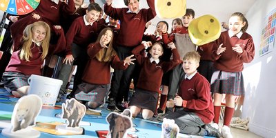 A group of schoolchildren in uniforms.