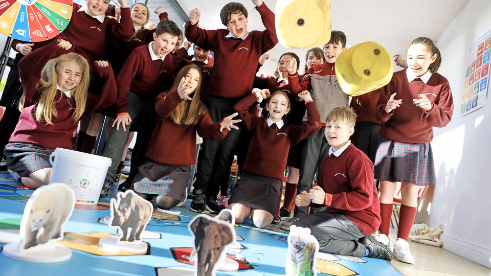 A group of schoolchildren in uniforms.