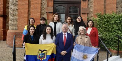Alumni with flags