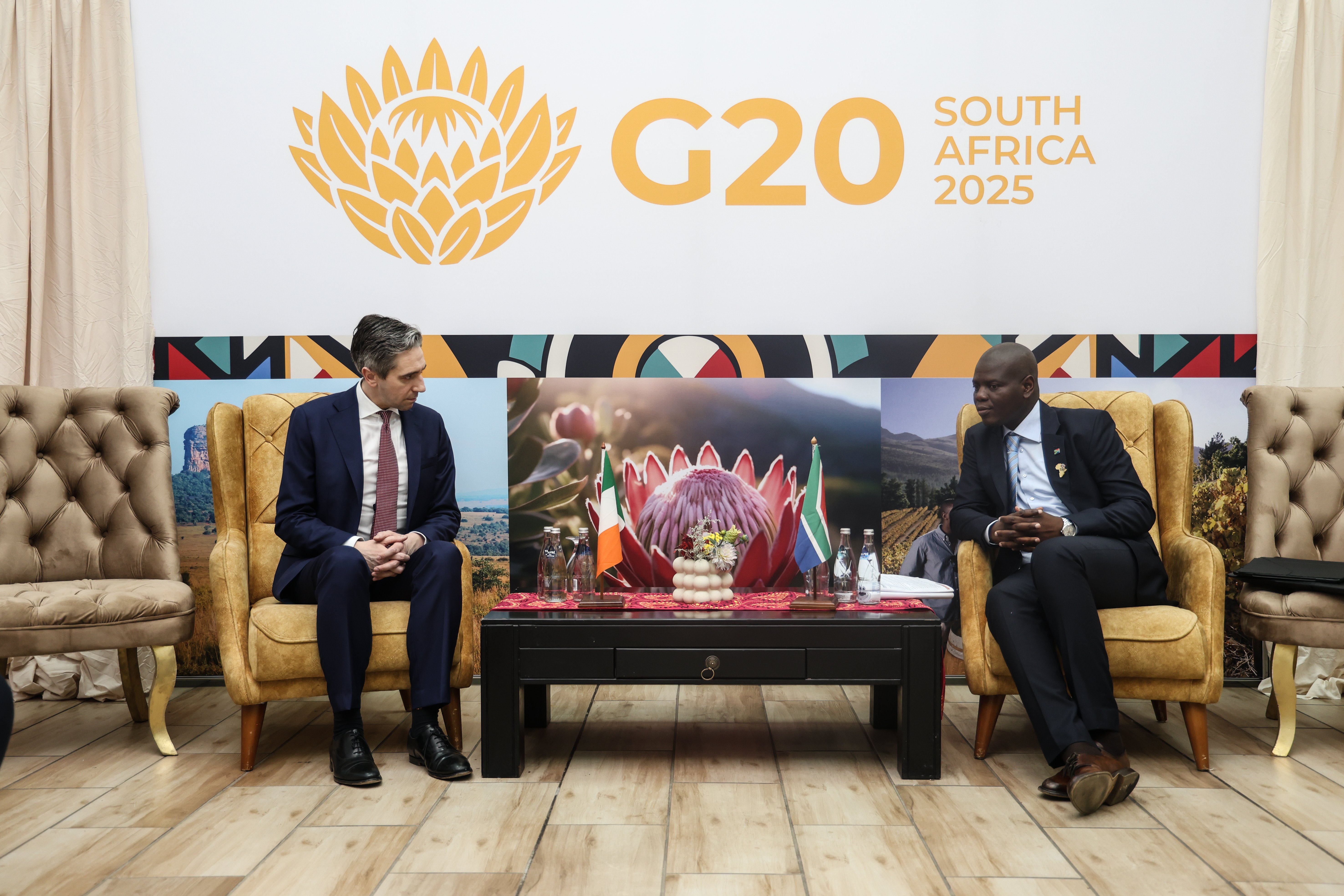 Tánaiste Simon Harris seated with South African Foreign Minister Ronald Lamola at G20.