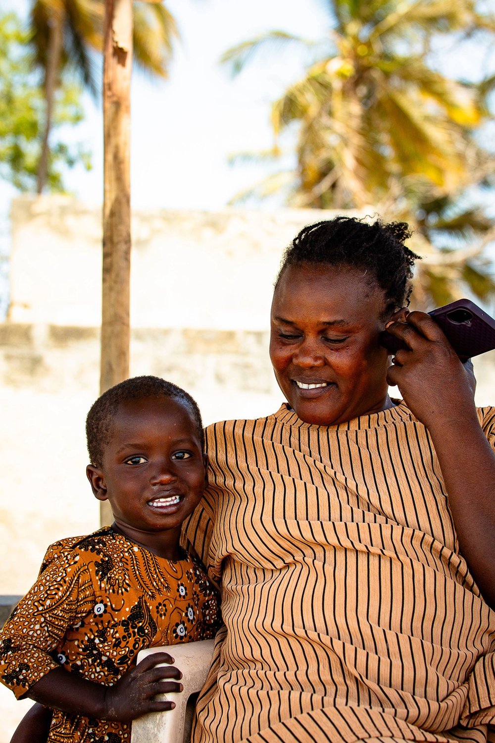 Woman smiling with a child.