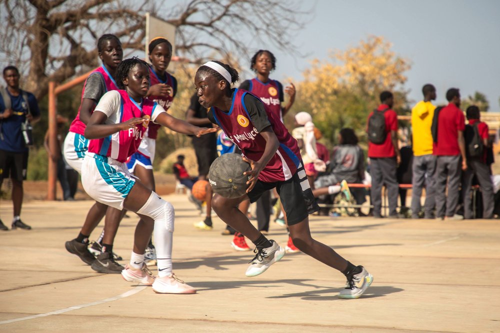 Group of girls playing basketball.