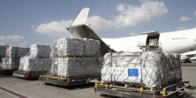 Palletts of food being loaded onto a plane