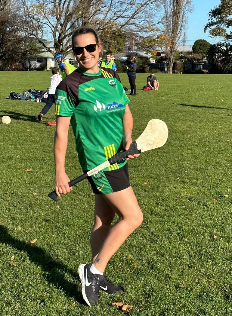 Kellie Condon smiling and holding a hurl