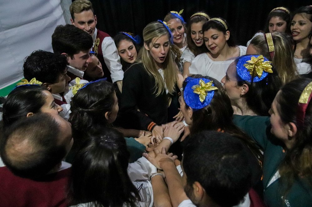 Dance group with all their hands together