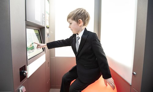 A child using a photobooth