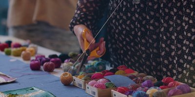 people making patchwork quilt