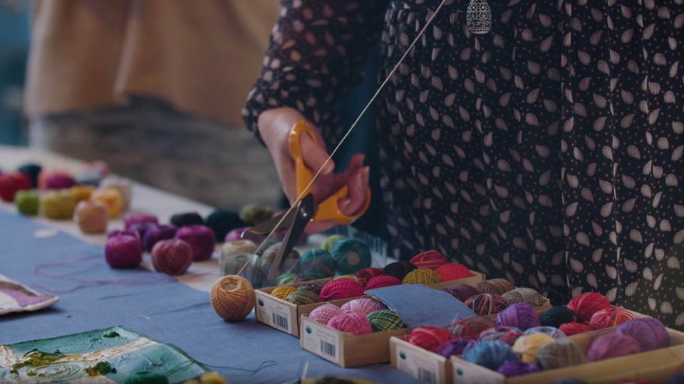 people making patchwork quilt