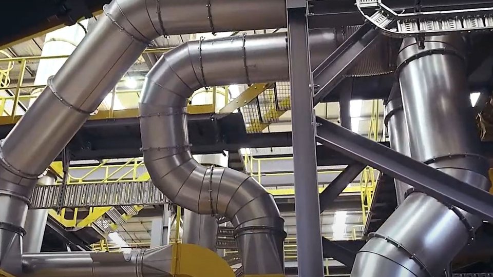 silver chutes and pipes in a factory