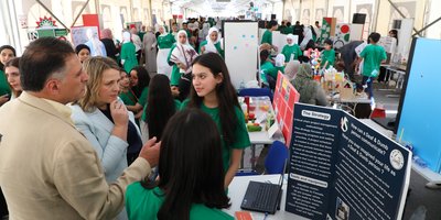 busy crowd at a science fair