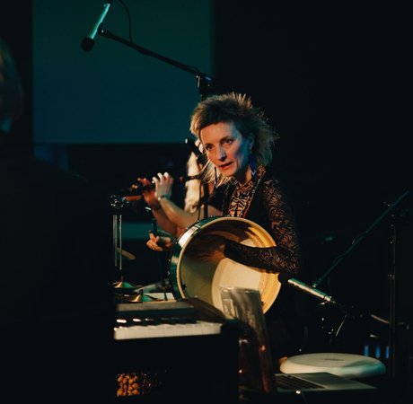 Two musicians on stage during a performance