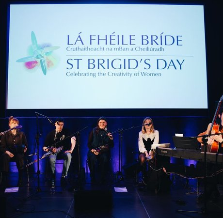 Six musicians on stage during a performance